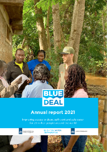 Cover of Annual Report 2021 with a photo of a group standing next to some trees and water