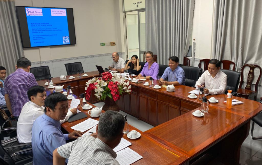 A group of people in a meeting in an office