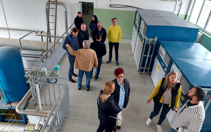 A group of people inside a water treatment plant