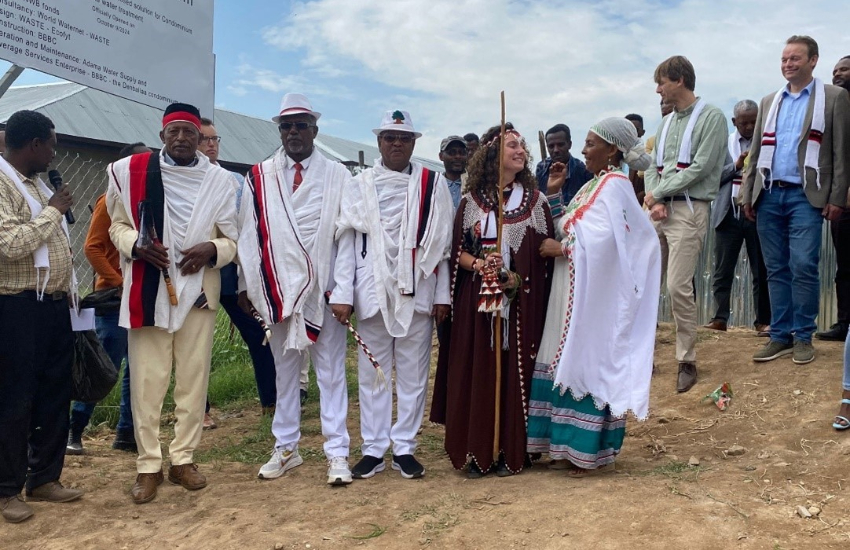 A picture of 5 people wearing Ethiopian traditional clothes.