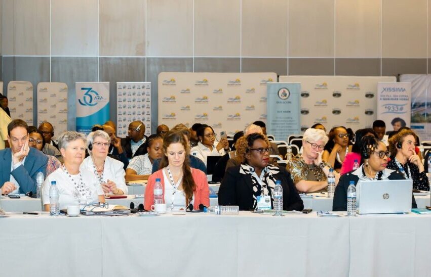 group of people at the tabel attending the REMCO conference