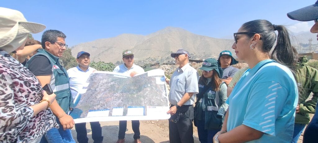 group of people studying a map