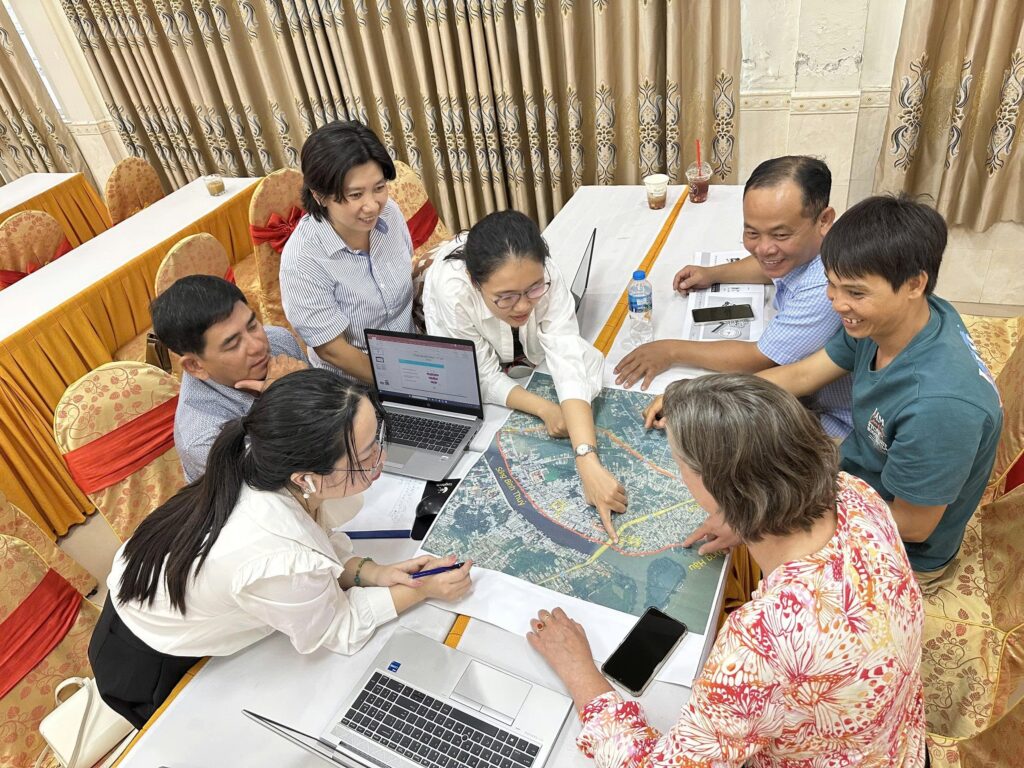 group working together in trining - map of mekong delta