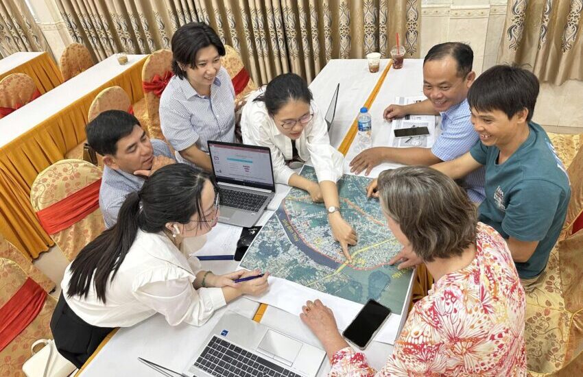 group working together in trining - map of mekong delta